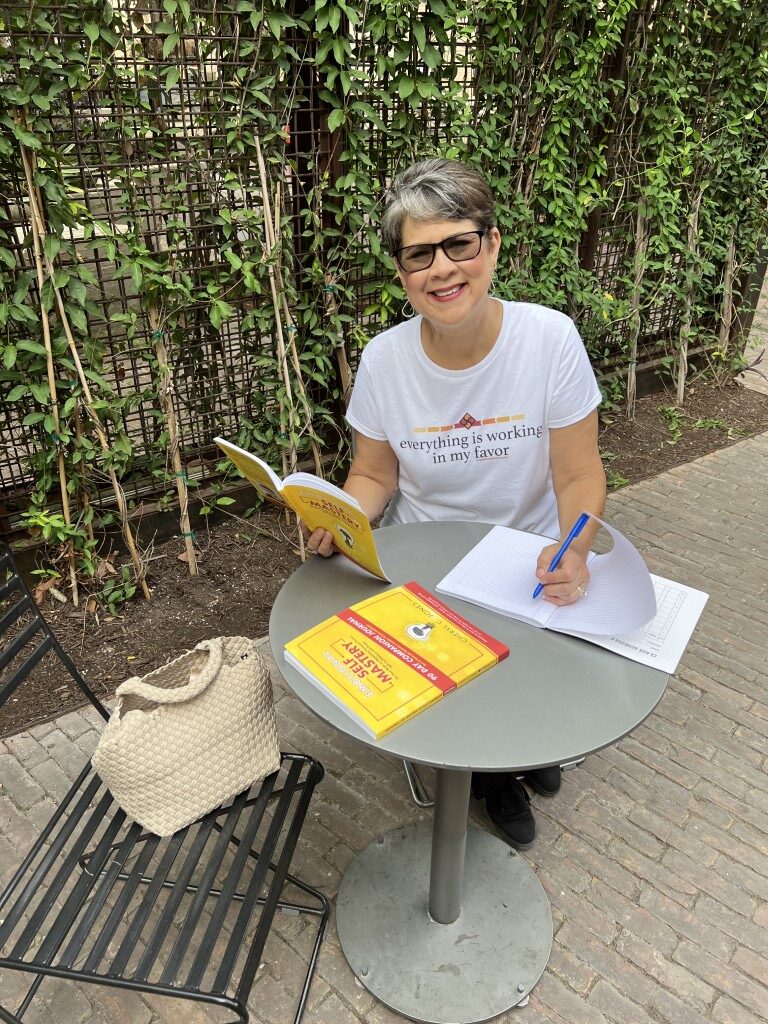 Cheryl Jones with her Self-Mastery book