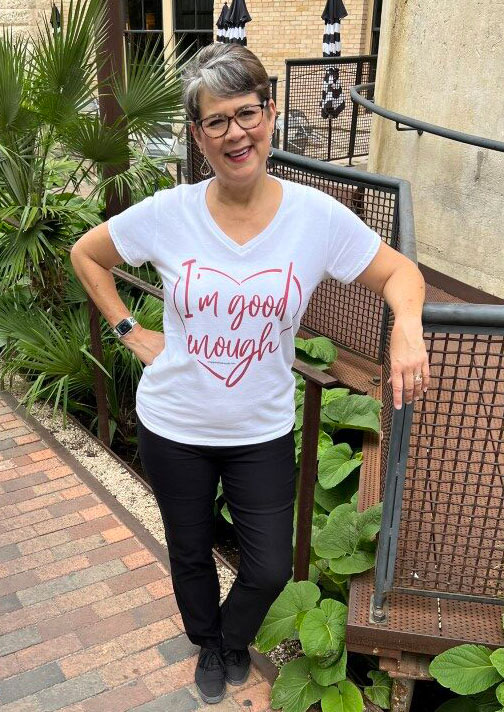 Cheryl wearing an I'm good enough t-shirt